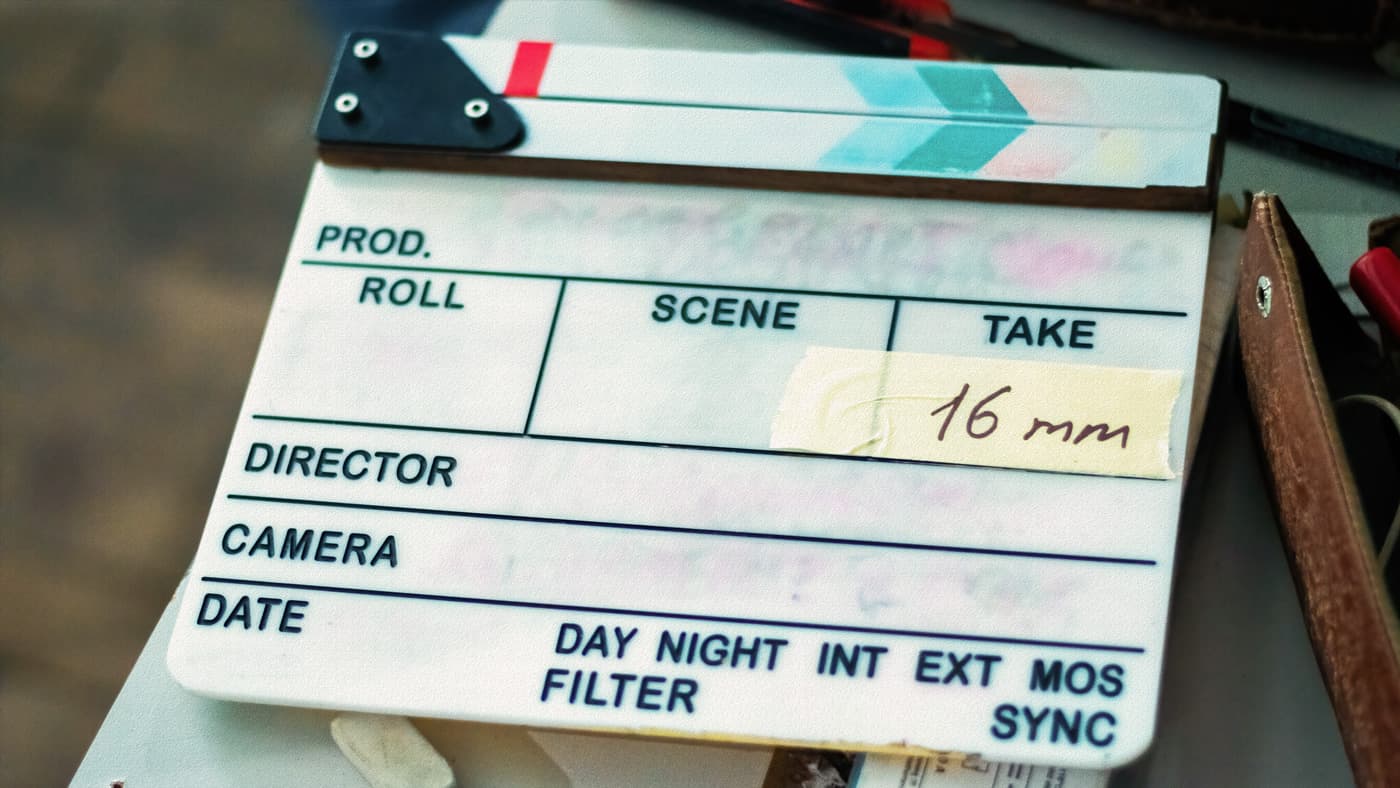 A classic film clapperboard resting on a set, symbolizing the start of a movie production.